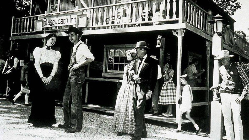 old photo of people in costumes at Silver Dollar City in front of 1881 Hotel in Branson, Missouri, USA