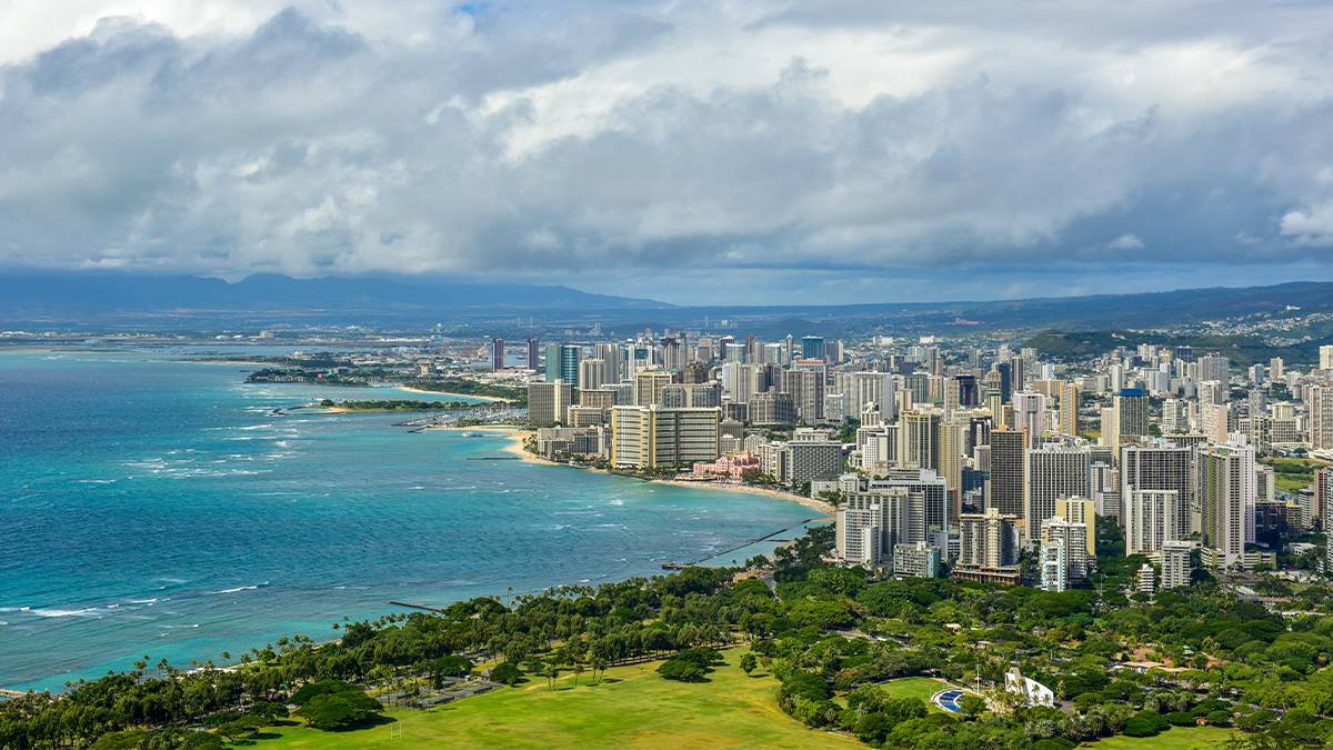 Blue coastline aerial view of city scape on Waikiki Beach in Honolulu, Hawaii, USA