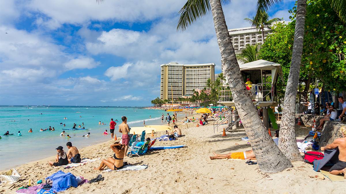 people on waikiki beach in Honolulu