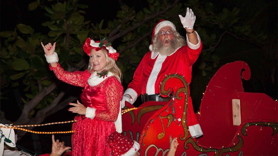 Mr and Mrs Claus in a sleigh in the Kailua Kona Christmas Parade in Kailua Kona, Hawaii, USA