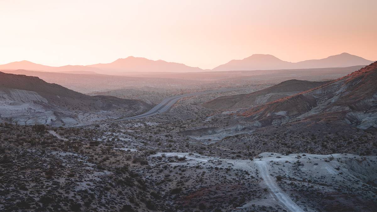 Wide shot of the Mojave Desert with a pink sunset near Las Vegas, Nevada, USA