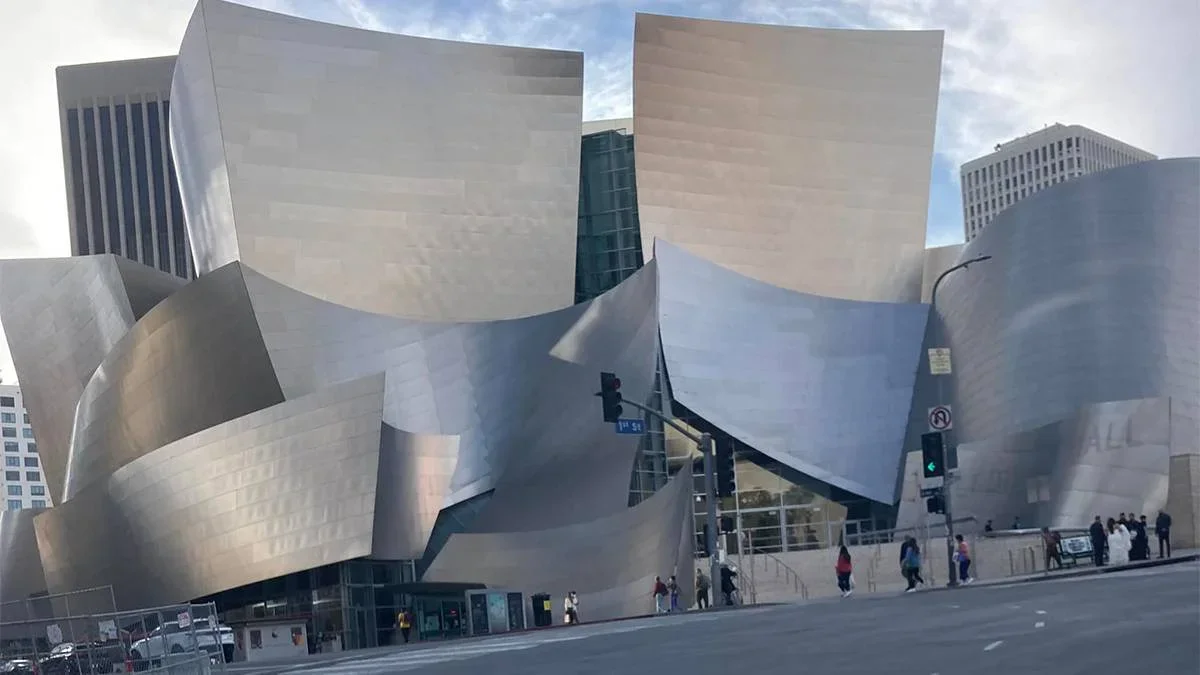 ground distant view of the Walt Disney Concert Hall on a sunny day with a blue sky in Los Angeles, California, USA