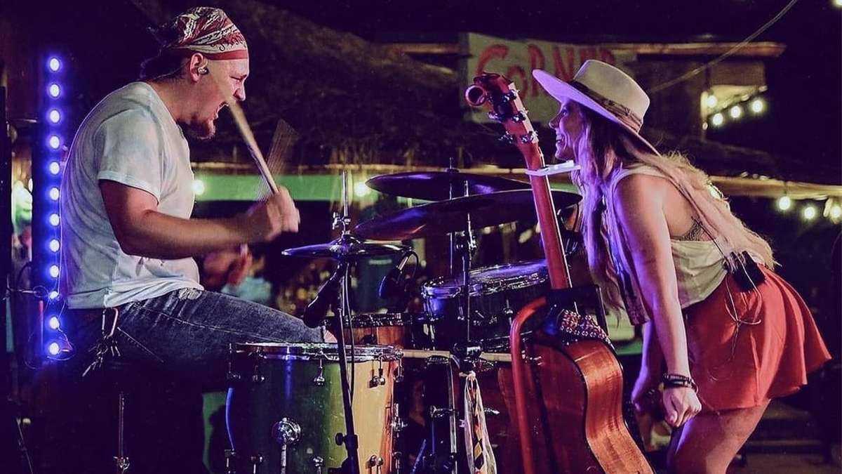 Performers singing on state at Tin Roof in Myrtle Beach, South Carolina, USA.