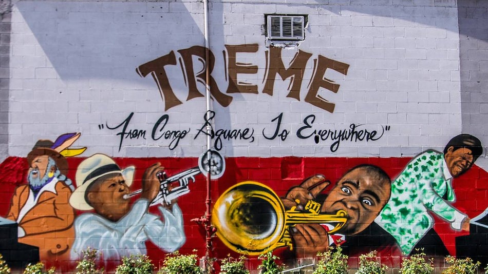 Mural of famous jazz musicians on a wall outside the Treme Tour by French Quarter Phantoms in New Orleans, Louisiana