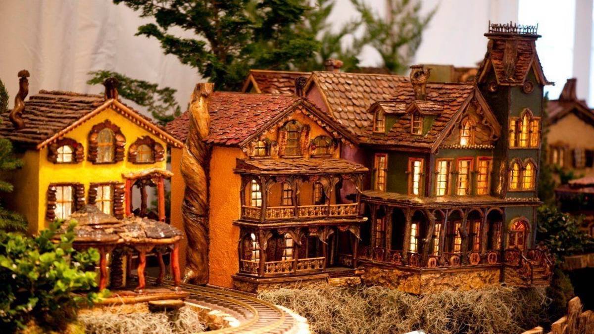 model houses with train tracks display