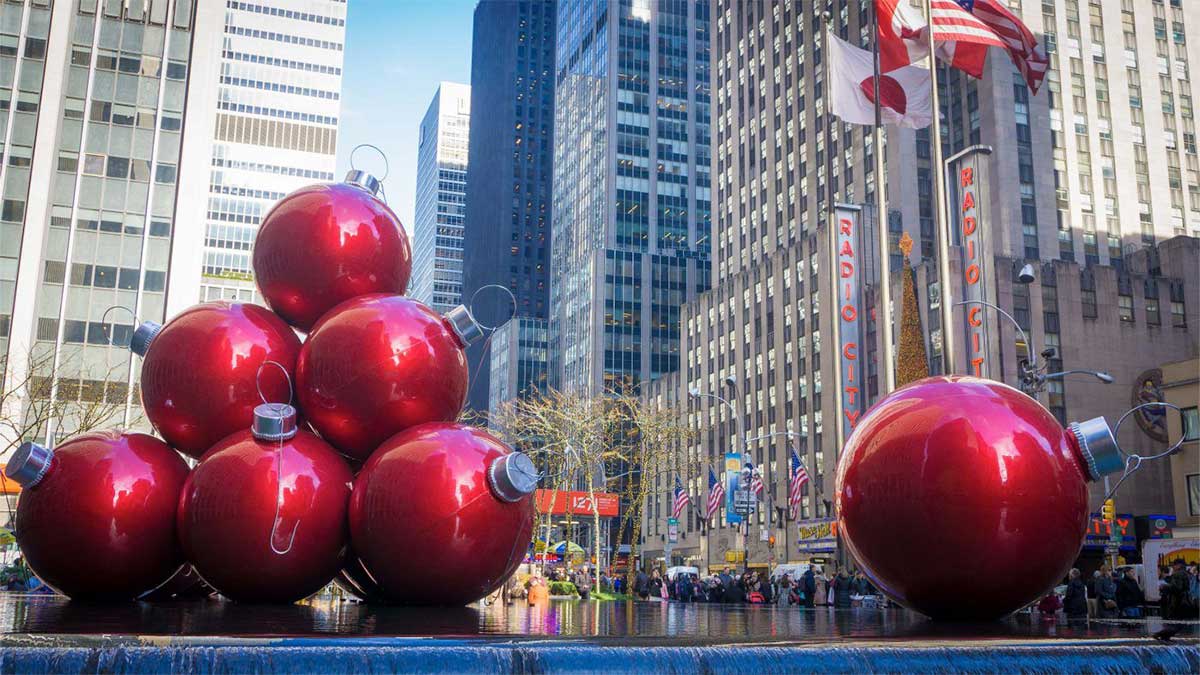 close up of giant red ornaments across from Radio City Music Hall at 1251 Sixth Avenue in NYC, New York, USA