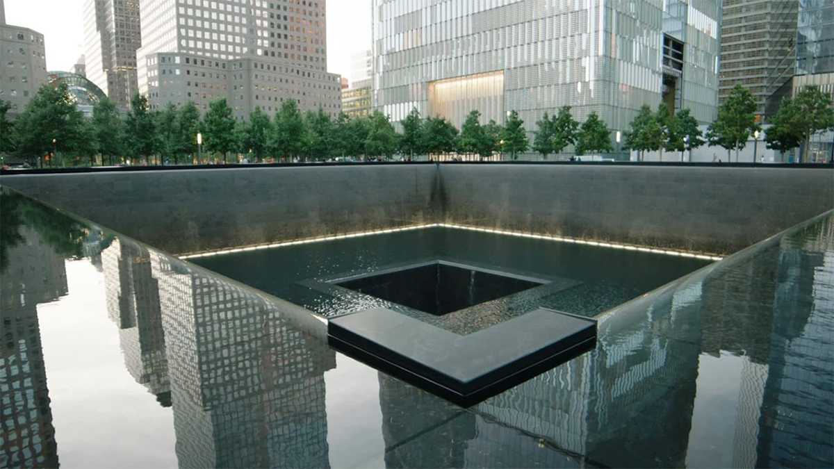 Close up of the reflecting pools at National September 11 Memorial & Museum with the city reflection showing in NYC, New York, USA