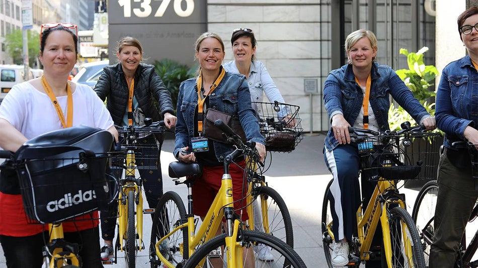 Group of women on yellow bikes on the Central Park Bike Tour in NYC, New York