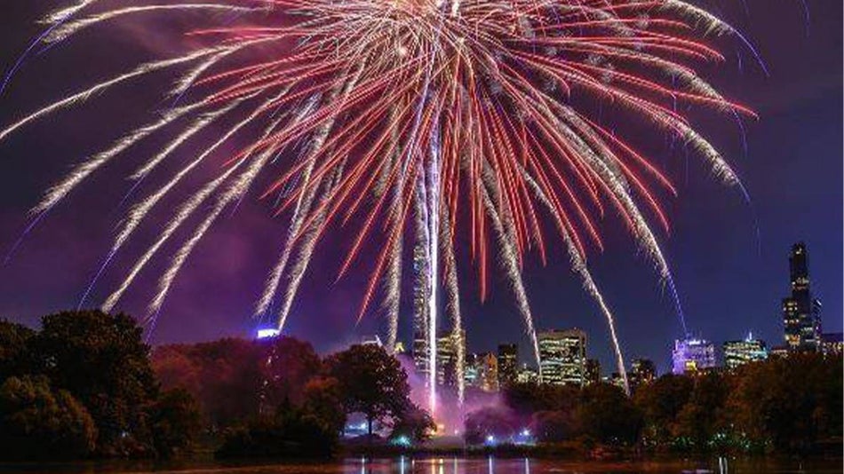 Wide shot of fireworks over Central Park in NYC, New York, USA