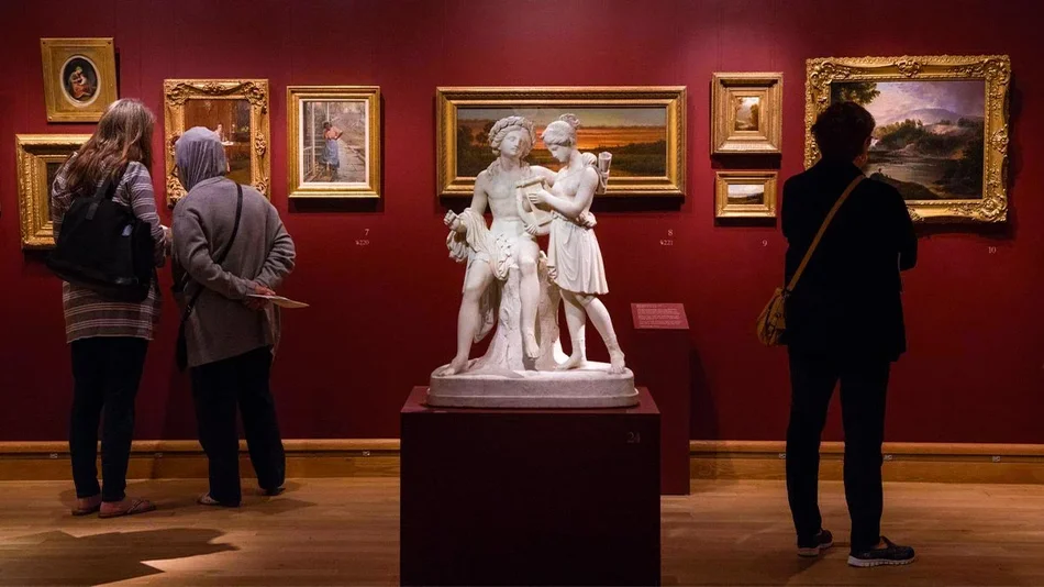 people looking at artwork inside of the Morse Museum in Orlando, Florida, USA