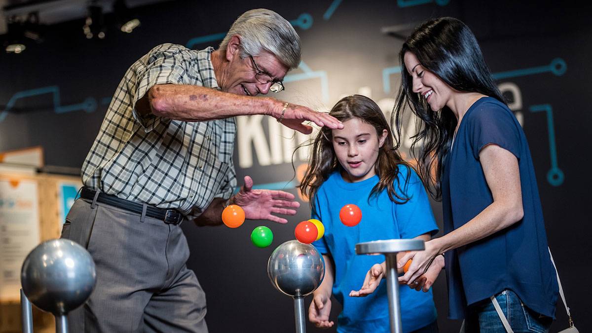 kids playing with a display inside of the Orlando Science Center in Orlando, Florida, USA