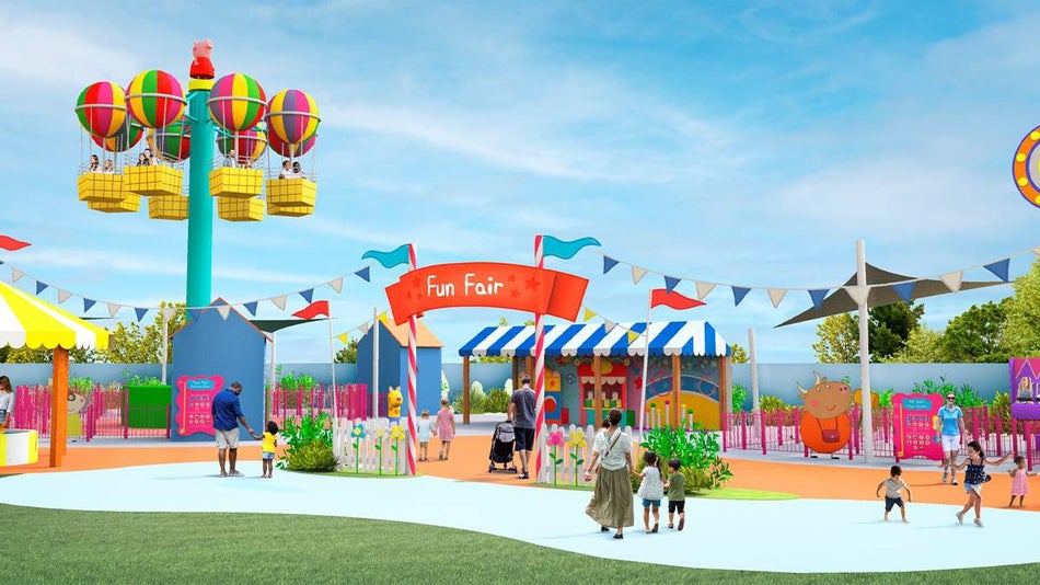 Wide shot of the very colorful Peppa Pig Theme Park with lots of banners and a balloon ride in Orlando, Florida, USA