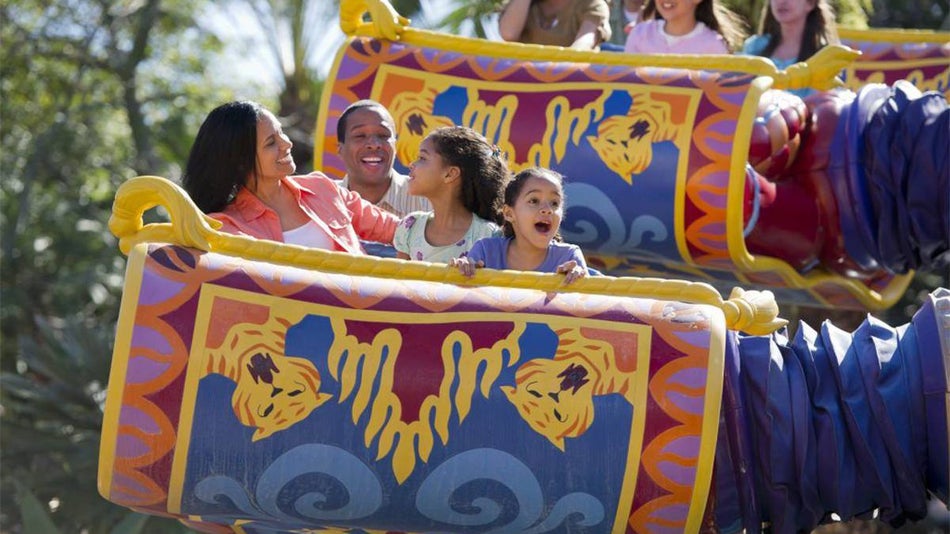 family riding theme park ride at Walt Disney World in Orlando, Florida, USA