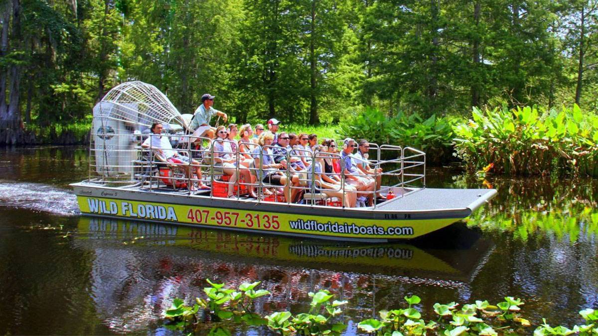 group of people on wild florida airboats tour in swamp