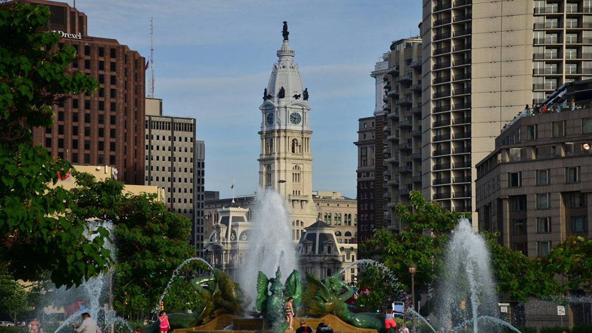 exterior view downtown with fountains and Philadelphia City Hall in Philadelphia, Pennsylvania, USA