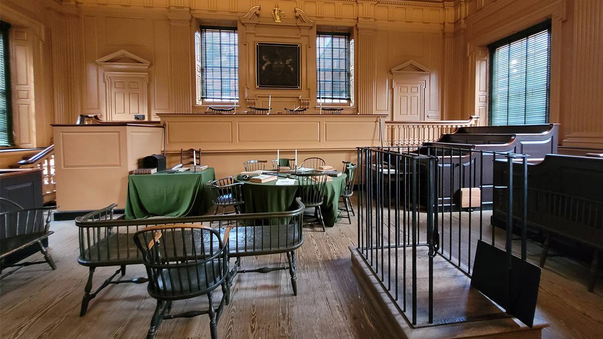 interior view of desks and chairs with candles inside the Independence Hall in Philadelphia, Pennsylvania, USA