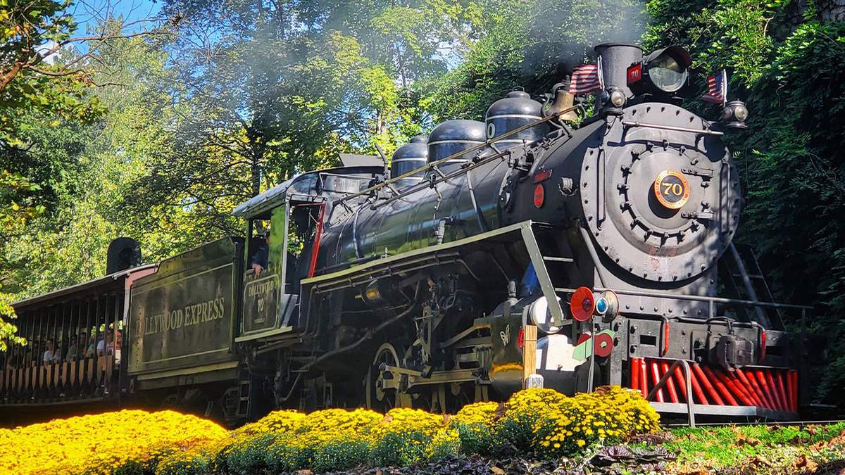 Close up of the Dollywood Express in motion at Dollywood on a sunny day in Pigeon Forge, Tennessee, USA