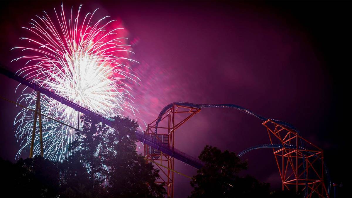 fireworks behind roller coaster at busch gardens summer nights in williamsburg virginia