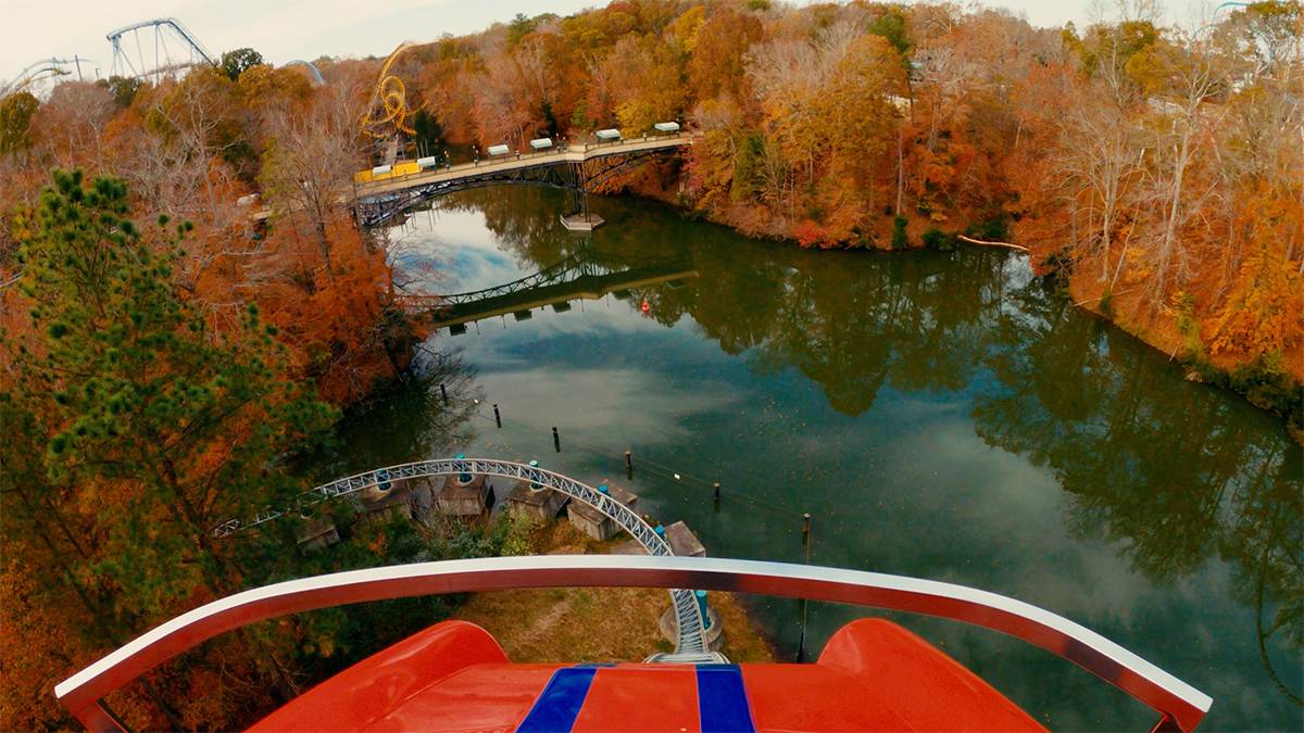 Point of view of being the first seat on a roller coaster going down hill in the fall at Busch Gardens in Williamsburg, Virginia, USA
