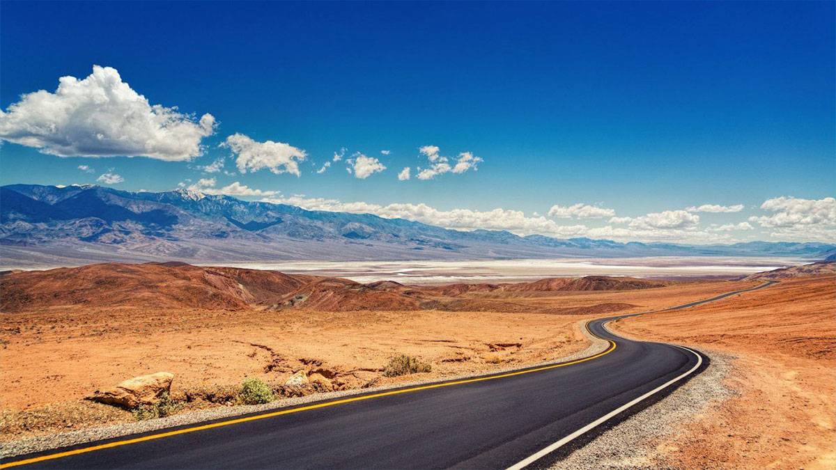 street and mountains in the background in Death Valley National Park near Las Vegas, Nevada, USA