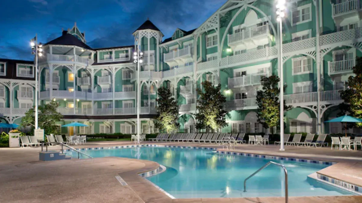 exterior night view of pool and resort at Disney’s Beach Club Resort in Orlando, Florida, USA