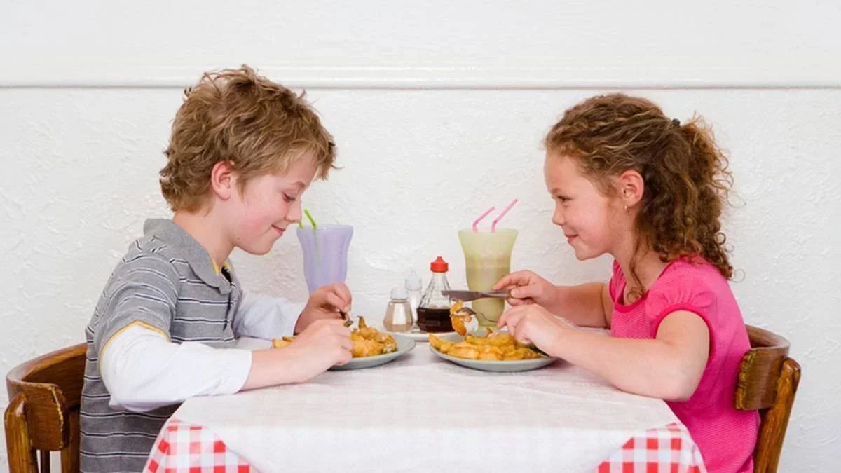 Two Kids eating together