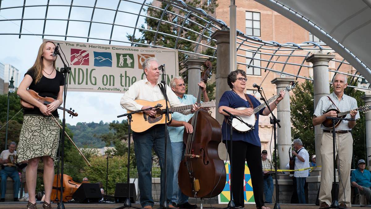 Folk band performing at Shindig on the Green in Asheville, North Carolina, USA