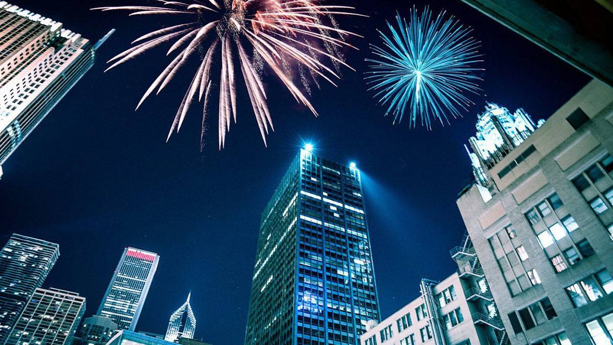 chicago skyline with fireworks over buildings for nye or fourth of july celebrations