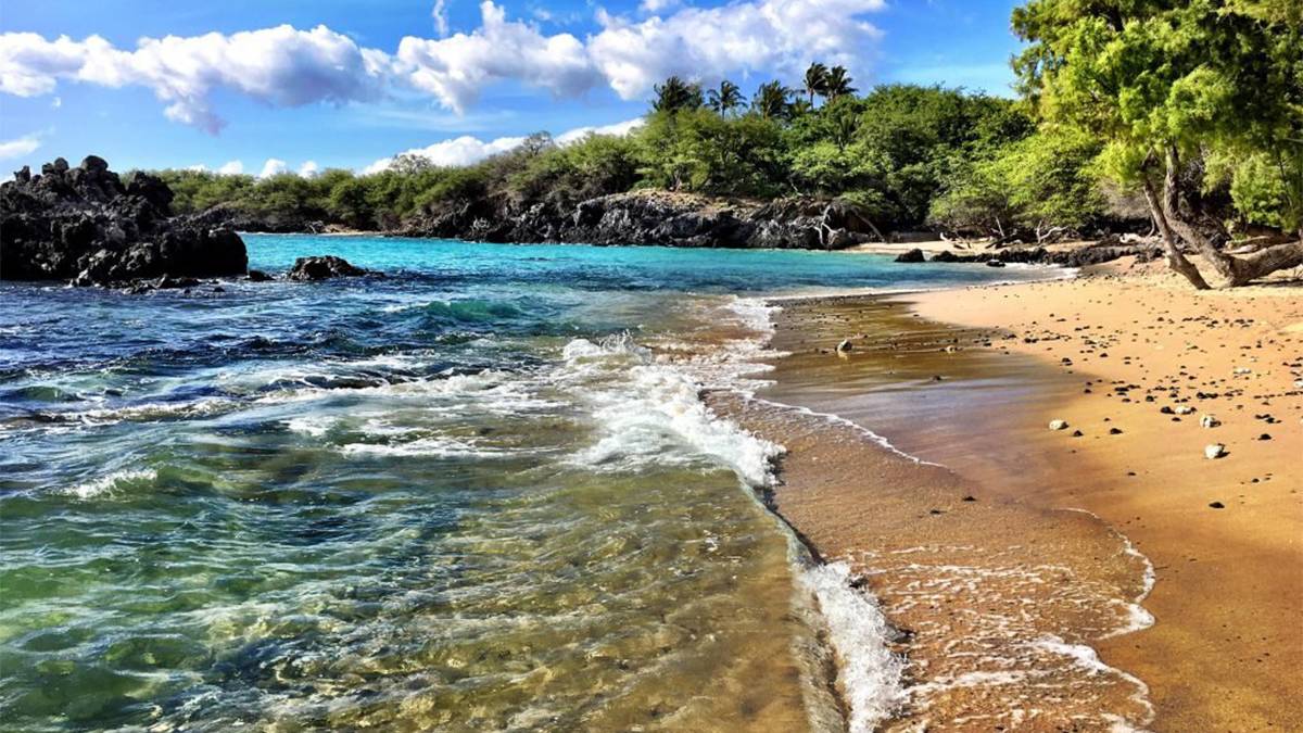 close up of coastline and blue waters at Puako Bay in Big Island Hawaii, USA