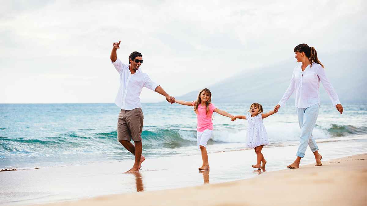 family running along beach during daytime in Kauai, Hawaii, USA