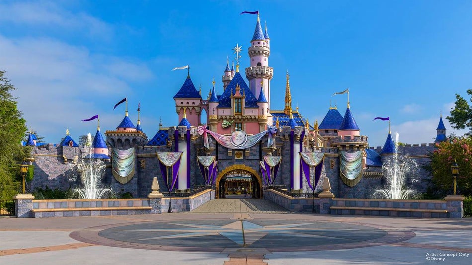 wide shot of Sleeping Beauty's castle with Disney 100 decor at Disneyland