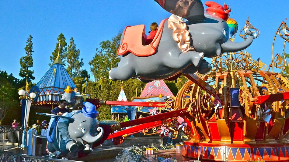 Wide shot of the Dumbo the Flying Elephant ride in Fantasyland at Disneyland in Los Angeles, California, USA