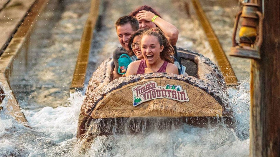 people onboard Timber Mountain Log Ride at Knotts Berry Farm in Los Angeles, California, USA