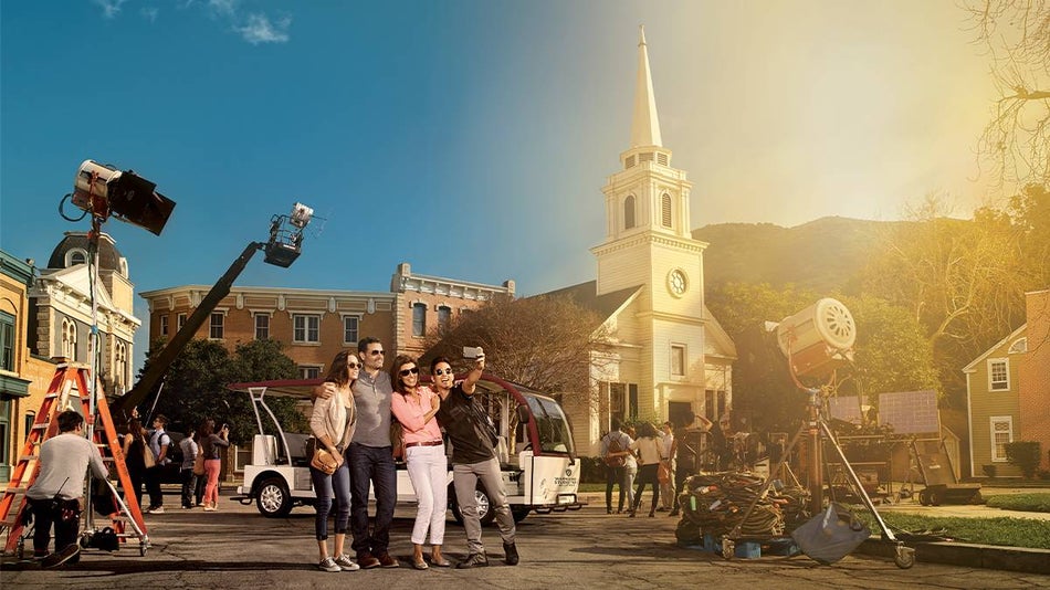 family posing with cameras at warner brothers studio tour in Hollywood