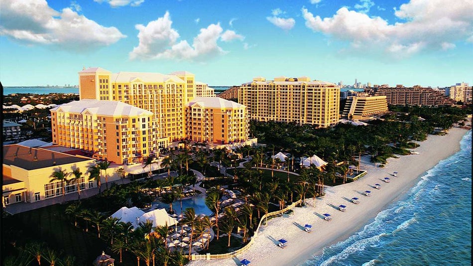 Aerial view of The Ritz-Carlton Key Biscayne with a blue cloudy sky behind it in Miami, Florida, USA