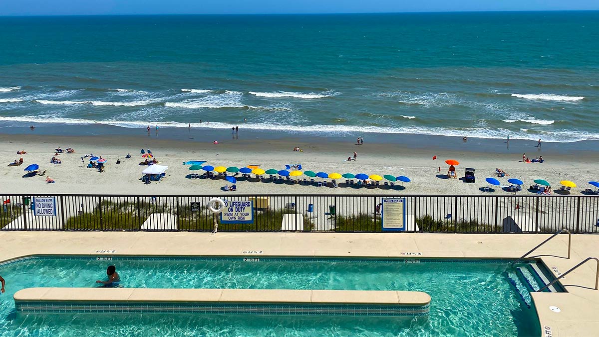 aerial view of the outdoor pool with view of beach and ocean at the Grande Shores Ocean Resort in Myrtle Beach, South Carolina, USA