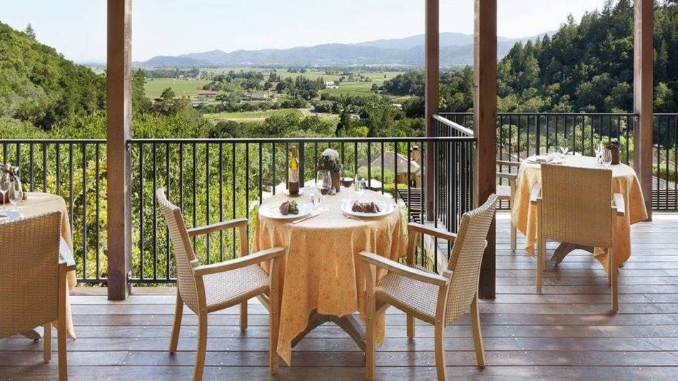 Patio tables at a restaurant overlooking the hills of Napa Valley
