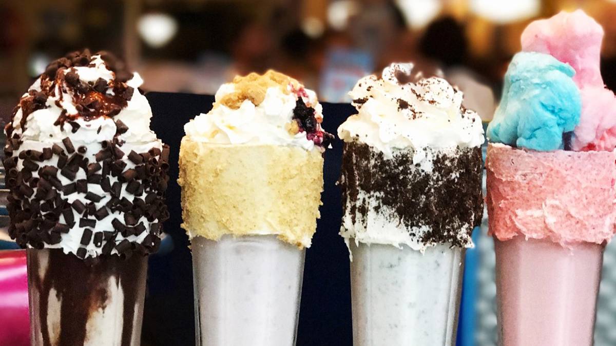 close up of four milkshakes on a colorful table at Big Daddy’s Diner in NYC, New York, USA