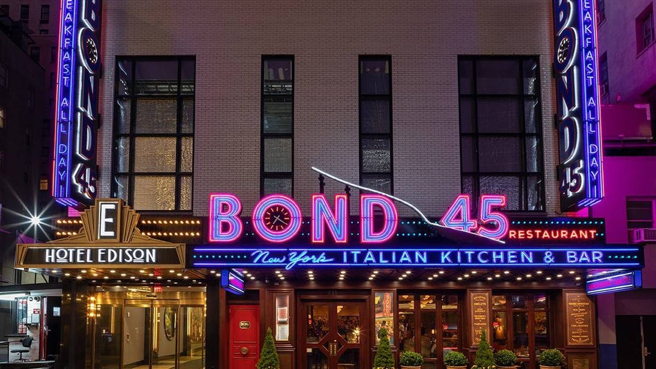 Street view of the neon sign on the front of Bond 45 in NYC, New York, USA