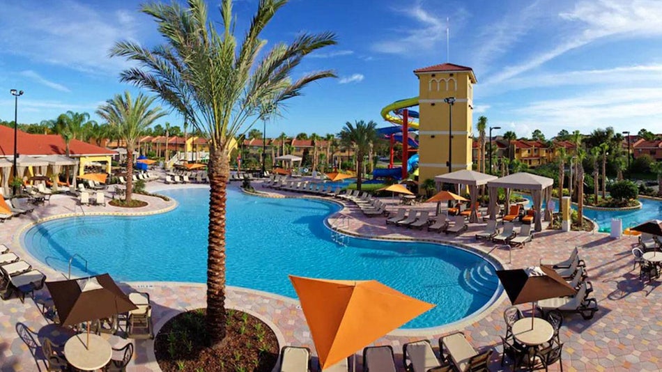 ground view of pool and exterior of Fantasy World Resort in Orlando, Florida, USA