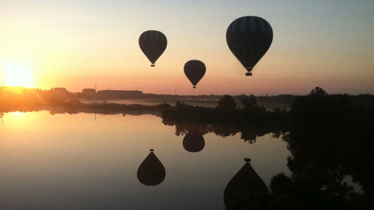 sunrise over hot air balloons in the air in Orlando, Florida, USA