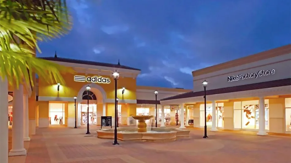 ground view of adidas and nike factory store at twilight at Orlando Premium Outlets in Orlando, Florida, USA