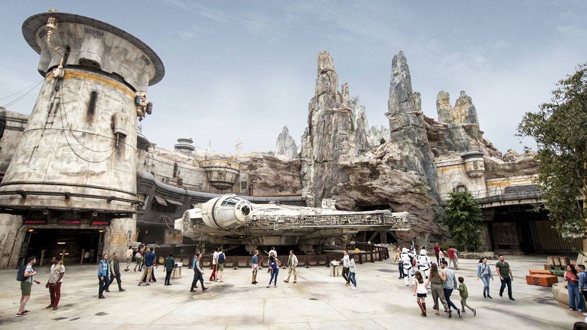 close up view of star wars galaxy's edge millennium falcon with guests walking around at Disney's Hollywood Studios in Orlando, Florida, USA
