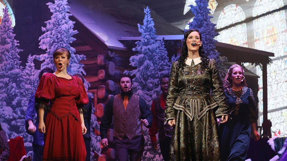 Close up of performers on stage singing at Christmas in the Smokies at Dollywood in Pigeon Forge, Tennessee, USA