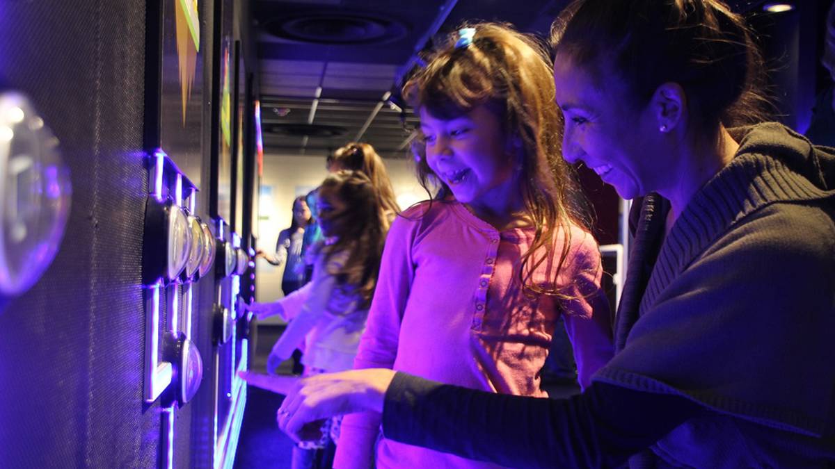 Mom and Child looking at an exhibit at the Fleet Science Center - San Diego, California, USA