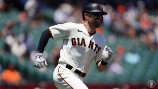 San Francisco Giants baseball player running and smiling in San Francisco, CA, USA