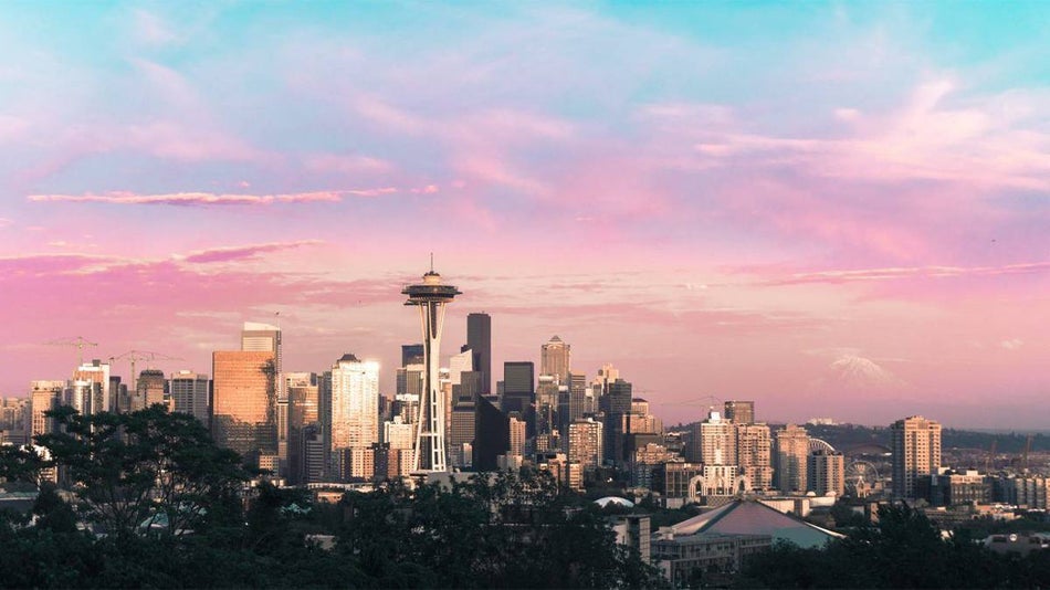 pink, purple, and blue skies as the sun rises over Seattle, Washington, USA