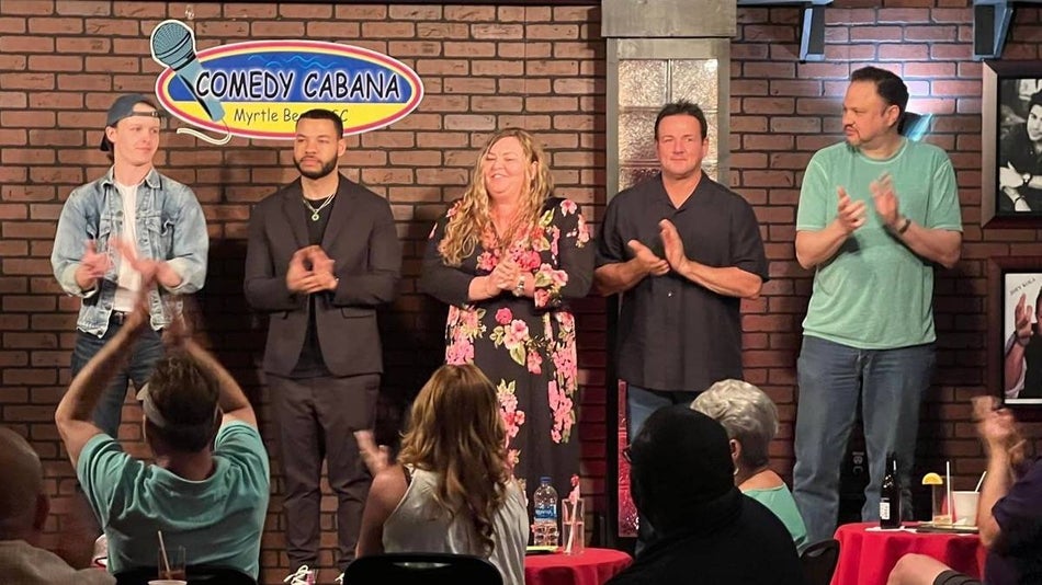 comedians standing on a stage with brick wall behind them at the Comedy Cabana in Myrtle Beach, South Carolina