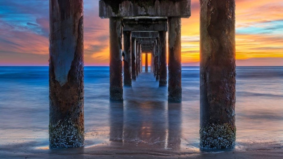 Shot under the pier at sunrise in St Augustine, Florida.