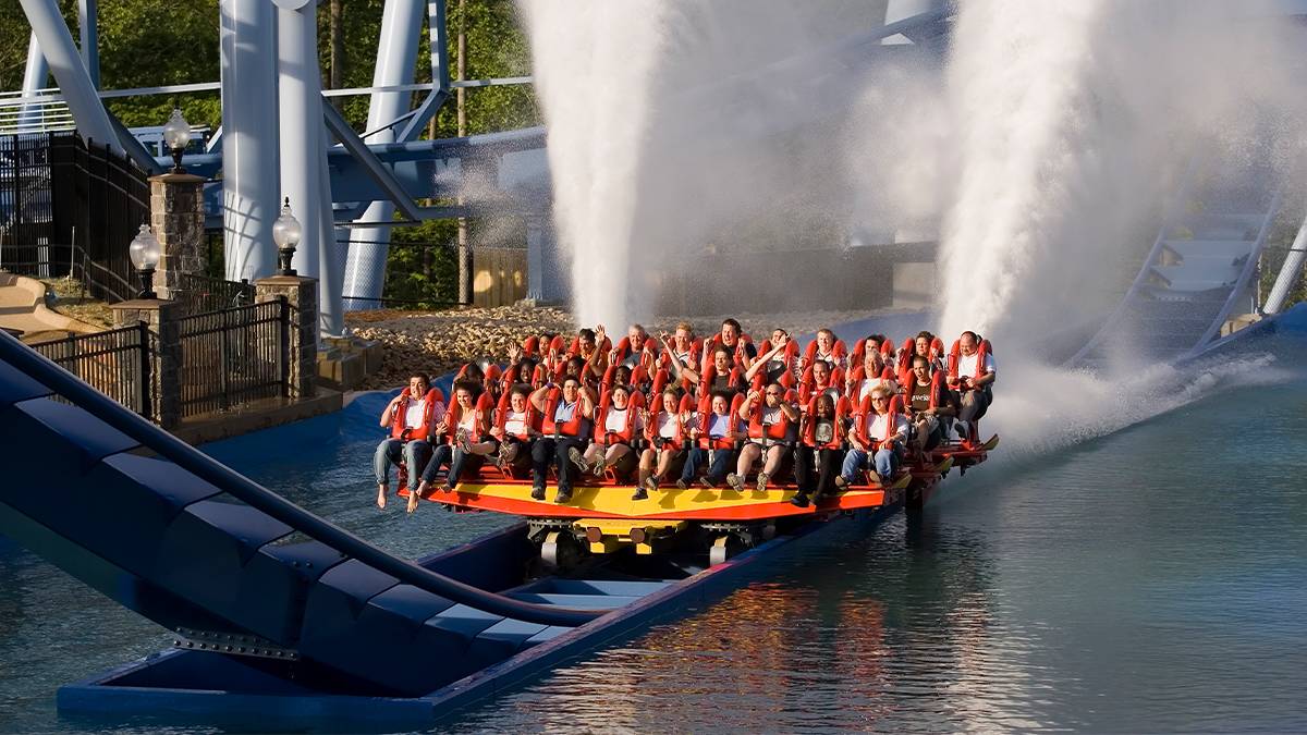 guests splashing through water on the Griffon Roller Coaster at Busch Gardens in Williamsburg, Virginia, USA